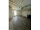 Spacious garage with concrete floor, a back door, and room for vehicles and storage at 3797 Monument St, Las Vegas, NV 89121