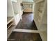 Hallway features built-in shelves, cabinets and tiled stone flooring at 3797 Monument St, Las Vegas, NV 89121