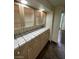 Hallway with cabinets, glass displays and tiled counters at 3797 Monument St, Las Vegas, NV 89121