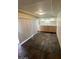 Hallway with sliding door access, built-in bar and tiled stone flooring at 3797 Monument St, Las Vegas, NV 89121