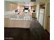 View of kitchen with appliances, long tiled counters and stone flooring at 3797 Monument St, Las Vegas, NV 89121
