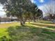 Community park area with mature trees, open green space, and park benches at 3797 Monument St, Las Vegas, NV 89121