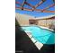 Backyard pool featuring a spa and built-in grill, offering a luxurious outdoor experience at 3797 Monument St, Las Vegas, NV 89121
