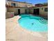 Inviting backyard pool with a unique shape, surrounded by a patio, ideal for outdoor entertaining at 3797 Monument St, Las Vegas, NV 89121