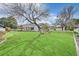 Large backyard with mature landscaping and generous lawn at 3938 E Russell Rd, Las Vegas, NV 89120