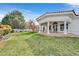 Expansive backyard with manicured lawn and covered patio, perfect for entertaining at 3938 E Russell Rd, Las Vegas, NV 89120