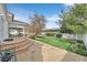 Sprawling backyard with covered patio and mature trees at 3938 E Russell Rd, Las Vegas, NV 89120