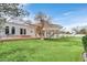Sprawling backyard with mature trees and brick patio at 3938 E Russell Rd, Las Vegas, NV 89120