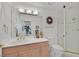 Bright bathroom featuring a vanity with ample counter space, walk-in shower, and neutral color palette at 3938 E Russell Rd, Las Vegas, NV 89120