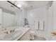 Bathroom with a shower-tub combo, single sink vanity, and classic fixtures at 3938 E Russell Rd, Las Vegas, NV 89120