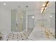Bathroom with glass-enclosed shower, double sinks with gold fixtures, and vanity lighting at 3938 E Russell Rd, Las Vegas, NV 89120