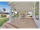 Covered patio features a brick floor, multiple windows and shade at 3938 E Russell Rd, Las Vegas, NV 89120