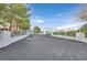 Long driveway with white brick and wrought iron entrance gate providing privacy at 3938 E Russell Rd, Las Vegas, NV 89120