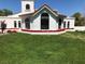 Well manicured lawn and tasteful landscaping accentuate this home's facade at 3938 E Russell Rd, Las Vegas, NV 89120