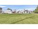Expansive home with a large lawn, architectural details, and mature landscaping at 3938 E Russell Rd, Las Vegas, NV 89120