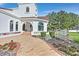 Lovely home with a curved brick walkway, rock garden, and a charming wooden bench at 3938 E Russell Rd, Las Vegas, NV 89120