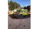 Landscaped front yard with rock garden, red flowers and green grass at 3938 E Russell Rd, Las Vegas, NV 89120