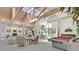 Large living room with fireplace, pool table, vaulted ceilings, and natural light at 3938 E Russell Rd, Las Vegas, NV 89120