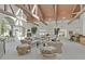 Expansive living room featuring vaulted ceilings, skylights, and neutral color palette at 3938 E Russell Rd, Las Vegas, NV 89120