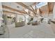 A spacious, bright living room with wood beams, skylights, and plush neutral-toned furniture at 3938 E Russell Rd, Las Vegas, NV 89120