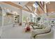 Bright and airy living room with vaulted ceilings, skylights, and neutral decor create an inviting space at 3938 E Russell Rd, Las Vegas, NV 89120