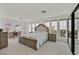 Spacious main bedroom with large windows, neutral decor, and plush carpeting at 3938 E Russell Rd, Las Vegas, NV 89120