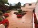 Beautiful landscaping with flowers and plants surround the outside of this home at 3938 E Russell Rd, Las Vegas, NV 89120