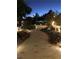 Pathways and landscaping illuminated at night at 3938 E Russell Rd, Las Vegas, NV 89120