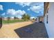 Expansive backyard with a covered patio and desert-friendly landscaping, perfect for low-maintenance living at 4400 E Cactus Canyon Dr, Pahrump, NV 89061