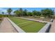 Outdoor bocce ball court with manicured landscaping and recreational space at 4400 E Cactus Canyon Dr, Pahrump, NV 89061