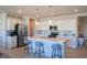 Bright kitchen with stainless appliances, white cabinets, and quartz countertops at 4400 E Cactus Canyon Dr, Pahrump, NV 89061