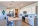 Bright kitchen with stainless appliances, white cabinets, and quartz countertops at 4400 E Cactus Canyon Dr, Pahrump, NV 89061