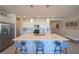 Bright kitchen with stainless appliances, white cabinets, and a large kitchen island at 4400 E Cactus Canyon Dr, Pahrump, NV 89061