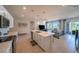 Open-concept kitchen and living room area with stainless appliances, island, and natural light at 4400 E Cactus Canyon Dr, Pahrump, NV 89061