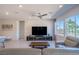 Bright living room features tile floors, recessed lighting, and a ceiling fan at 4400 E Cactus Canyon Dr, Pahrump, NV 89061