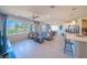 Spacious living room with backyard view, featuring modern furniture and a large television at 4400 E Cactus Canyon Dr, Pahrump, NV 89061