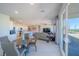 Spacious living room with an open floor plan, kitchen island, comfortable seating, and outdoor access at 4400 E Cactus Canyon Dr, Pahrump, NV 89061
