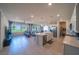 Open concept living room and kitchen with an island and stainless appliances at 4400 E Cactus Canyon Dr, Pahrump, NV 89061