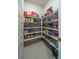 Organized walk-in pantry with shelves for storing food items and small appliances at 4400 E Cactus Canyon Dr, Pahrump, NV 89061