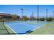 Bright blue and green community tennis courts offer a great place to exercise and enjoy time outdoors at 4400 E Cactus Canyon Dr, Pahrump, NV 89061