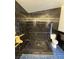 Bathroom features large, tiled shower, tiled flooring, and toilet at 4508 W San Miguel Ave, North Las Vegas, NV 89032