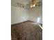 Bedroom with neutral colored walls, neutral carpet, and a modern ceiling fan with lights at 4508 W San Miguel Ave, North Las Vegas, NV 89032