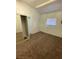 Bedroom with closet, window, and carpeted flooring at 4508 W San Miguel Ave, North Las Vegas, NV 89032