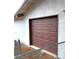 Garage door is brown and has a standard design at 4508 W San Miguel Ave, North Las Vegas, NV 89032