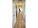 Hallway features neutral walls, tile flooring, and arched entrances at 4508 W San Miguel Ave, North Las Vegas, NV 89032
