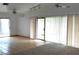 Open concept living room with tile flooring, sliding doors, and lots of natural light at 4508 W San Miguel Ave, North Las Vegas, NV 89032