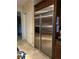 Kitchen featuring a stainless steel refrigerator and tile flooring at 4738 Laurel Canyon St, Las Vegas, NV 89129
