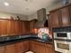 Well-equipped kitchen featuring wooden cabinetry, stainless steel appliances, and stylish backsplash at 4738 Laurel Canyon St, Las Vegas, NV 89129