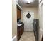 Practical laundry room with sink, granite counters and matching washer and dryer at 4738 Laurel Canyon St, Las Vegas, NV 89129