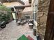 Outdoor patio with brick flooring, fireplace and a dining set for enjoying the fresh air at 4738 Laurel Canyon St, Las Vegas, NV 89129